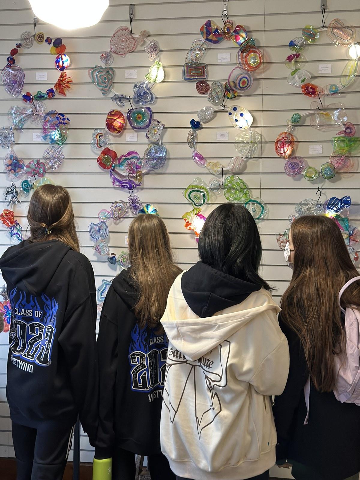Students take in the fused-plastic reef sculptures they created for Reach to Teach: Immersed in the Arts.