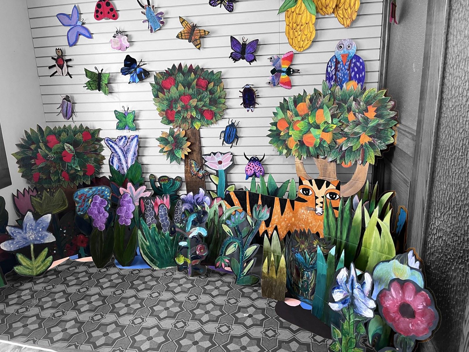 A student-made paper garden of flowers, insects and animals from Reach to Teach: Immersed in the Arts.