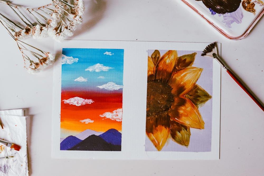 Bright paintings created in a CACR youth arts program